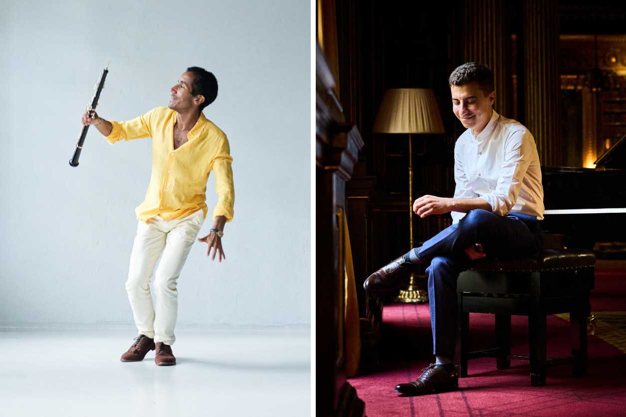 A man with an oboe and a man sitting by a piano