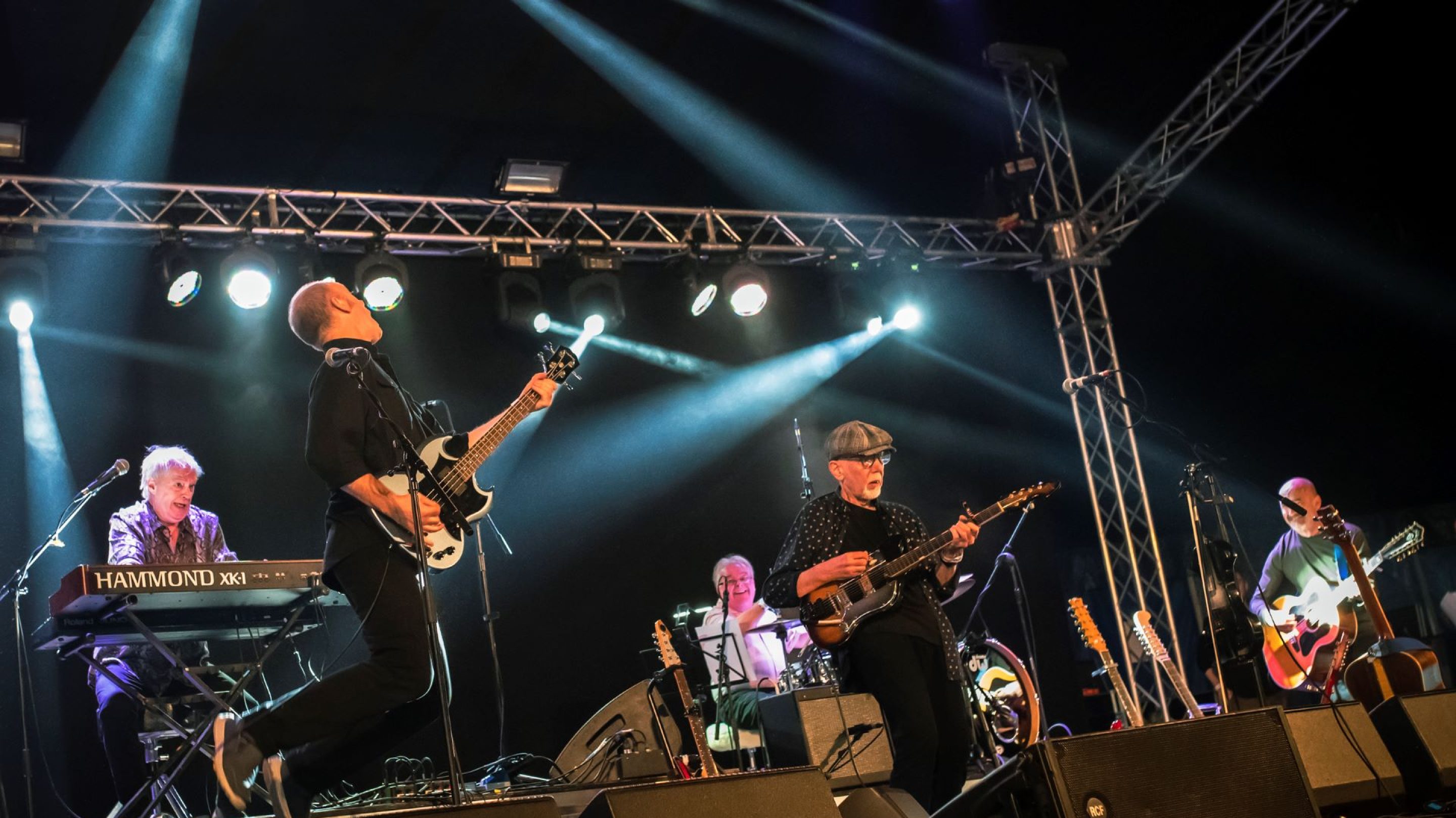 Men on stage from the band LINDISFARNE performing